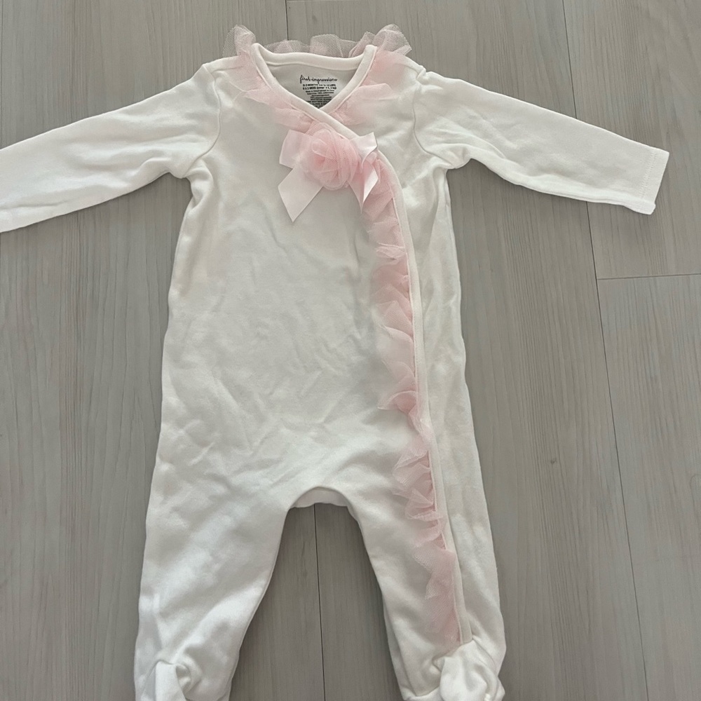 First Impressions onesie